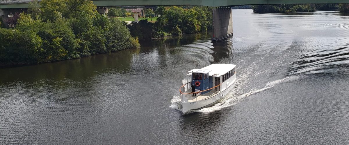 20220927_114732 (1) a boat traveling across a bridge over a body of water