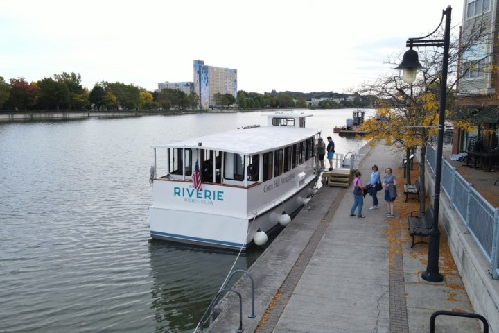 a boat is docked next to a body of water