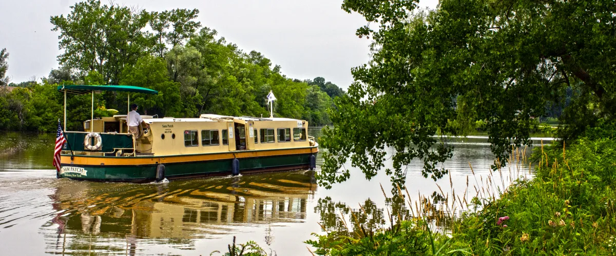 SamPatch_FNL_2 a bus driving down a river