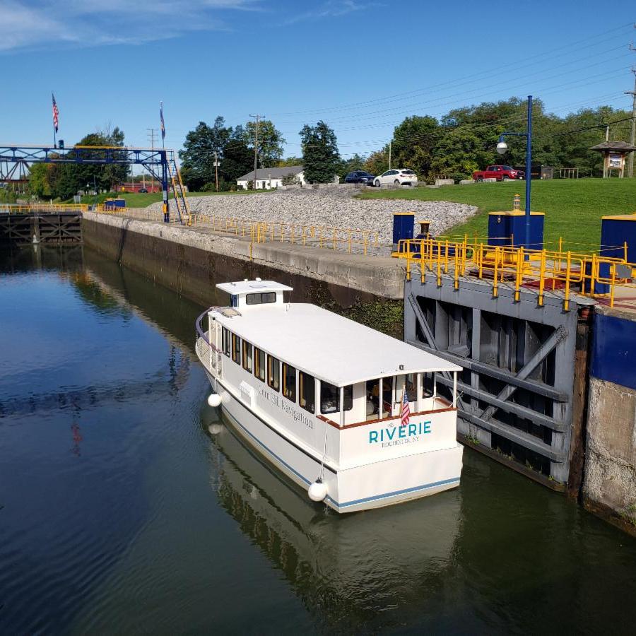 a boat is docked next to a body of water