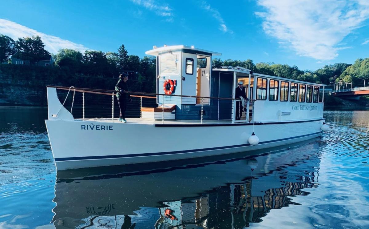 a boat is docked next to a body of water