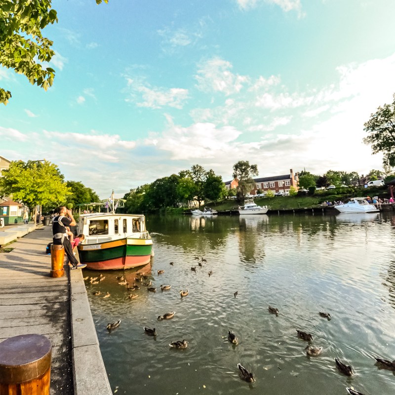 a boat is docked next to a body of water