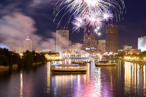 fireworks in the night sky over a body of water