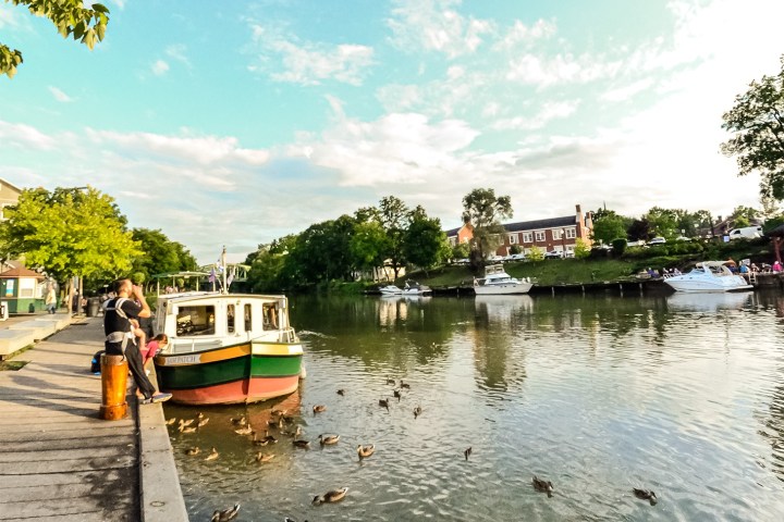 a boat is docked next to a body of water