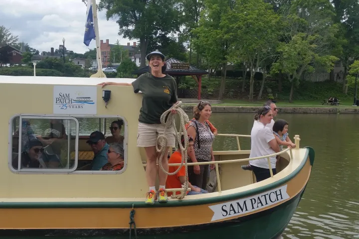 a group of people riding on the back of a boat