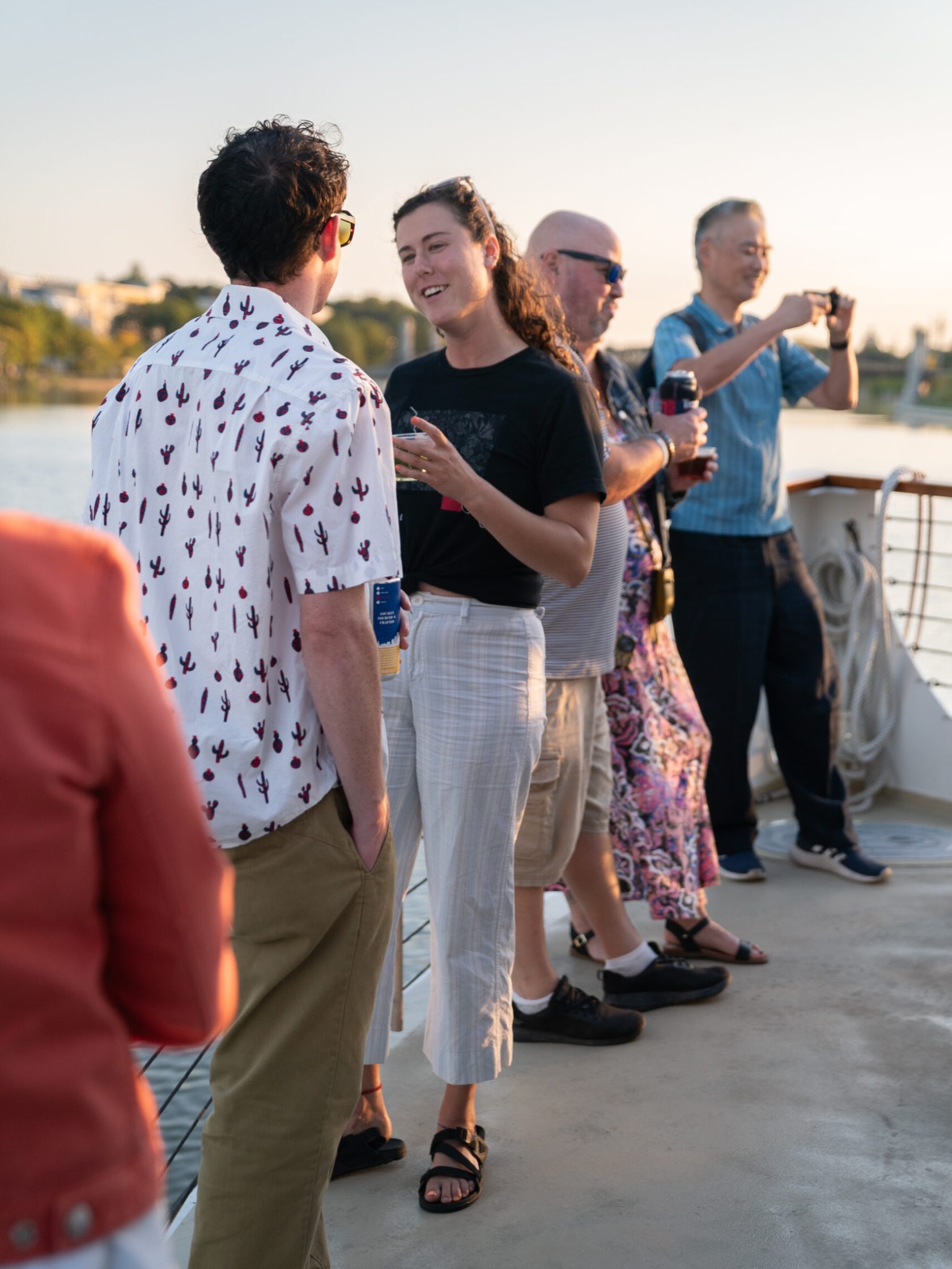 a group of people looking at a cell phone