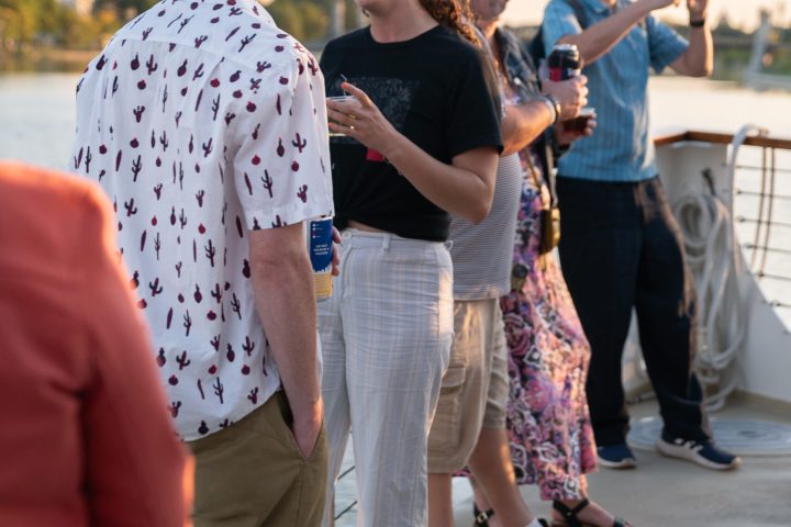 a group of people looking at a cell phone