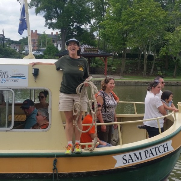 a group of people riding on the back of a boat