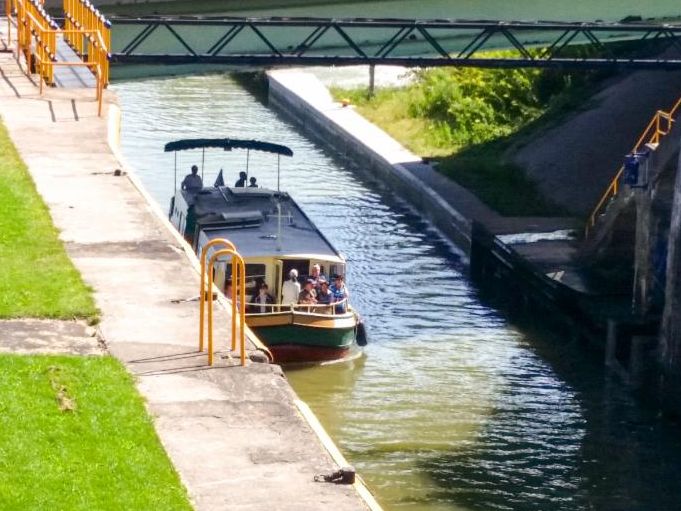 a train crossing a bridge over a body of water