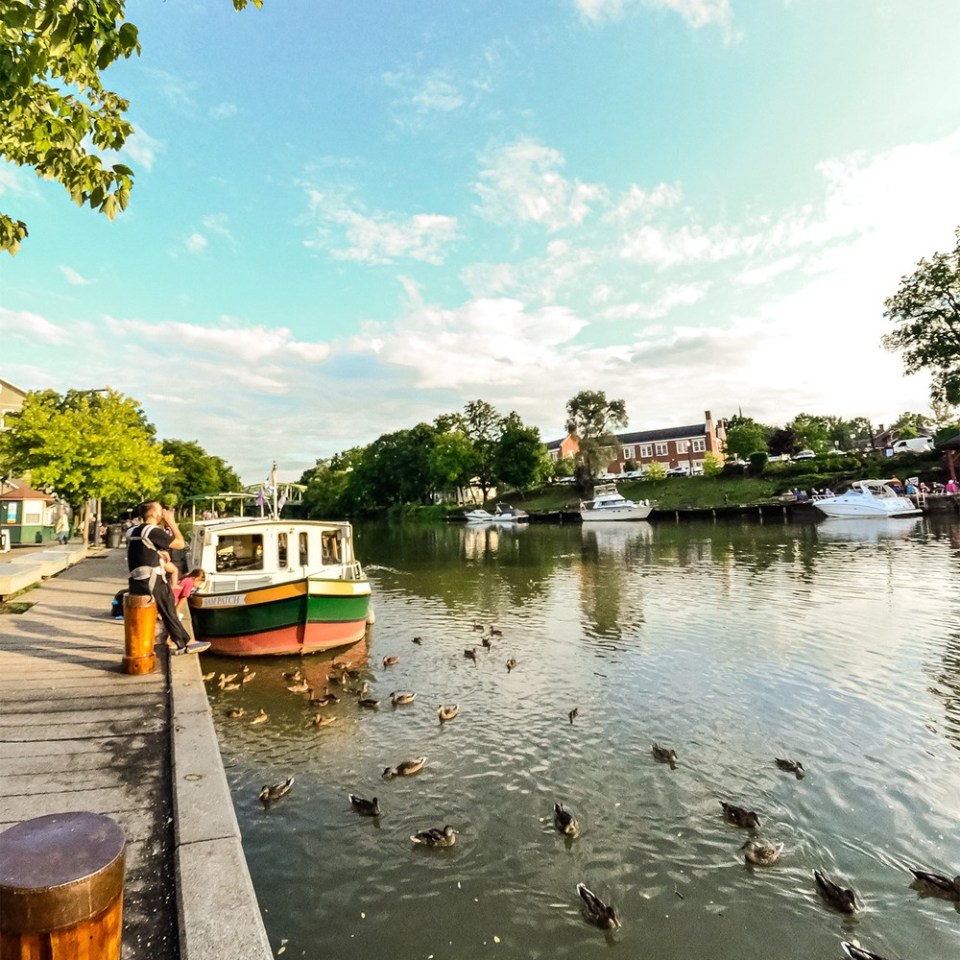 a boat is docked next to a body of water