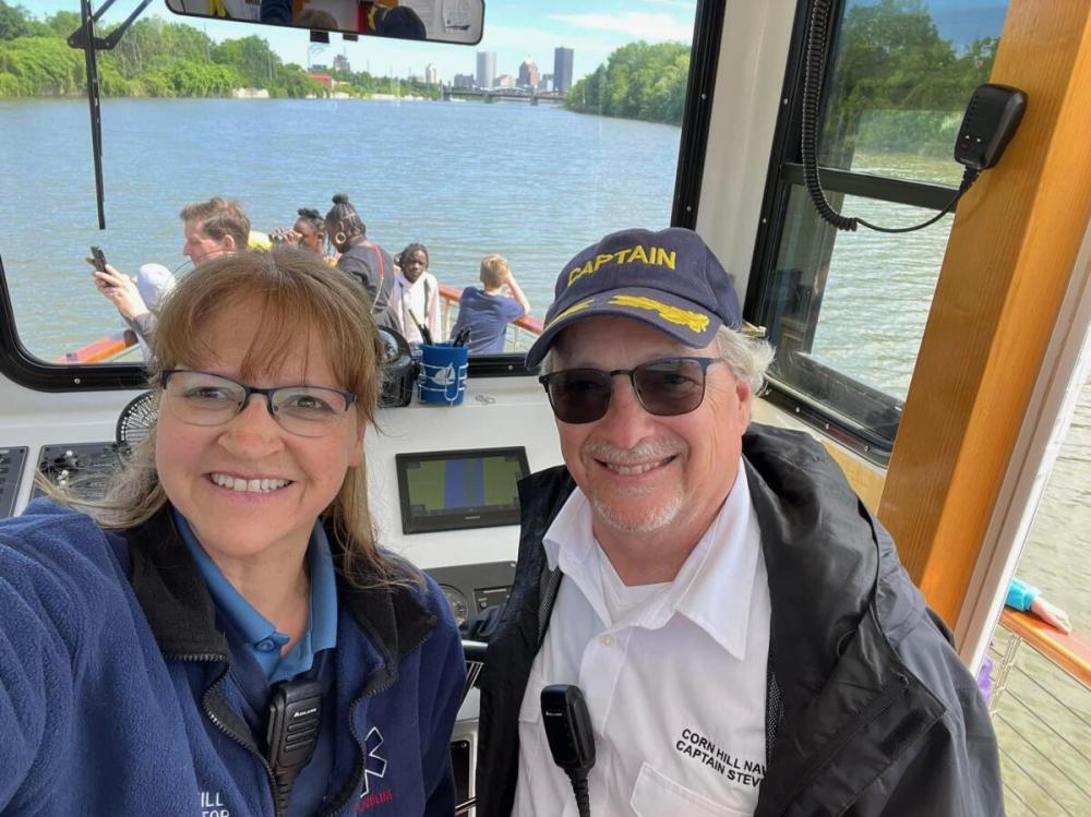 a couple of people on a boat posing for the camera