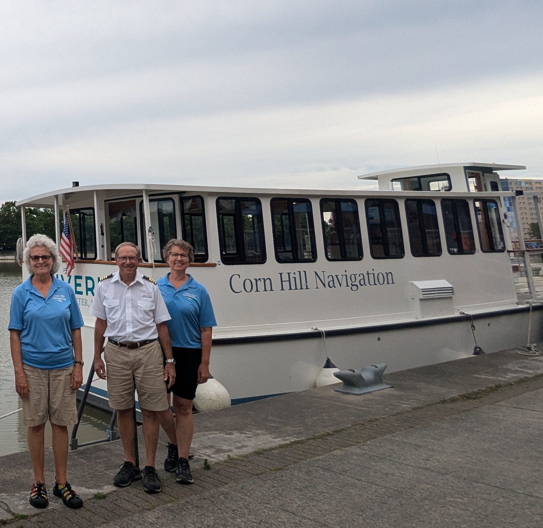 a group of people standing in front of a bus