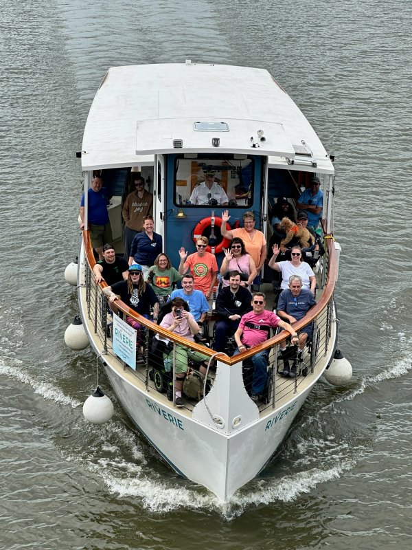 a group of people riding on the back of a boat